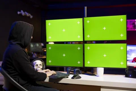 Hacker doing ransomware attacks using isolated screen multi monitor setup 스톡 사진