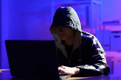 Hacker executing cyberattack to breach data and compromise digital security Stock Photos