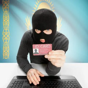 Hacker with flag on background holding ID card in hand - Kazakhstan Hacker... Stock Photos