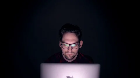 Hacker focused to work on computers at night in a dark room. 스톡 동영상 104802847