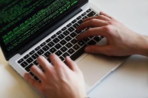 Hacker in front of his computer Stock Photos