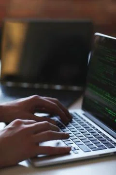 Hacker in front of his computer Stock Photos