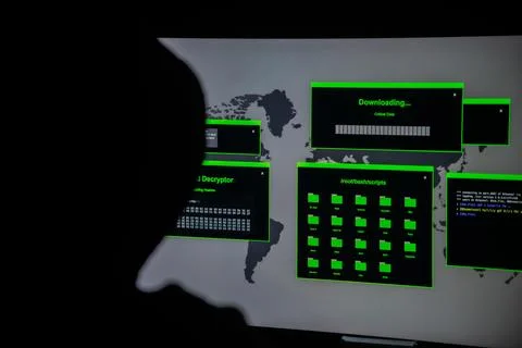 Hacker in front of a screen Stock Photos