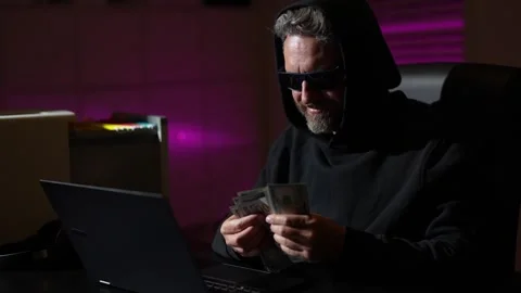 Hacker gamer at night in office count money. Cyber attack. Cyber criminal and Stock Footage 321025227