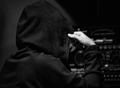 Hacker girl using a dangerous malware to attack the government database. Stock Photos