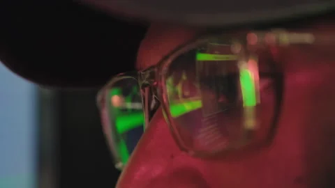Hacker in Glasses Stealing Users Data on Server Computer at Night Stock Footage 245367961
