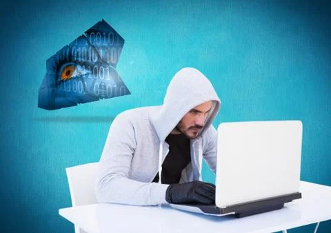 Hacker with glove using a laptop in front of blue background Stock Photos