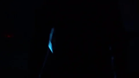 The hacker goes past the corner of the wall and sits down at the computer. Vídeos de archivo 82730502