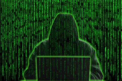 Hacker on green digital background 写真素材