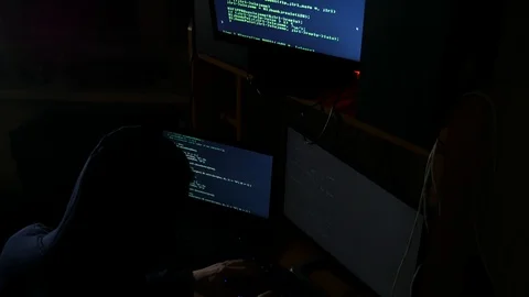 Hacker hacked an internet code, an attacker was working on his computer Stock Footage 125555338