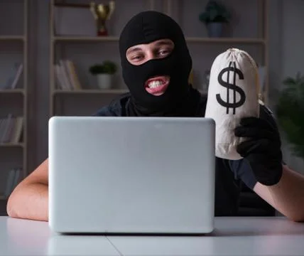Hacker hacking computer late at night Stock Photos