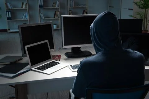 Hacker hacking computer at night Stock Photos