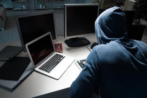 Hacker hacking computer at night Stock Photos