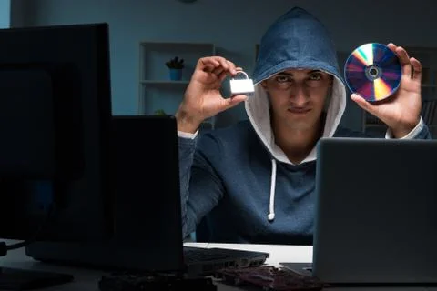 Hacker hacking computer at night Stock Photos