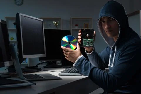 Hacker hacking computer at night Stock Photos