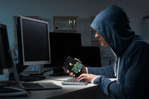 Hacker hacking computer at night Stock Photos