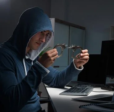 Hacker hacking computer at night Stock Photos
