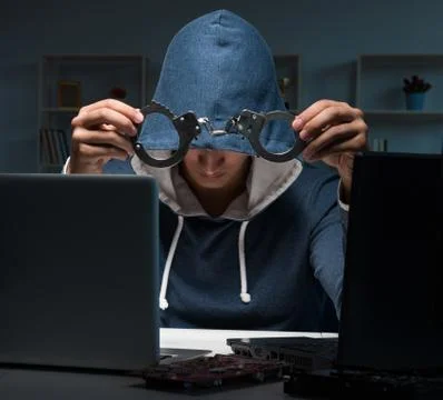 Hacker hacking computer at night Stock Photos