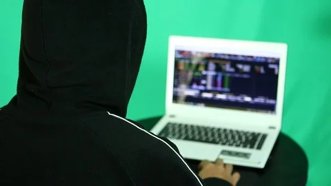 Hacker  hacking  data from laptop Stock Footage 96248131
