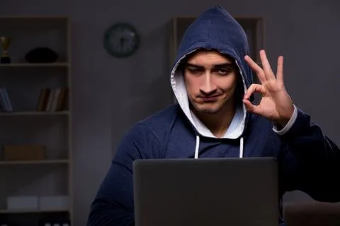 Hacker hacking the data late at night Stock Photos