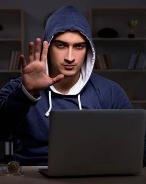Hacker hacking the data late at night Stock Photos