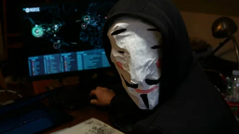 Hacker Hacking Database Computer Hack Screen with Face Mask internet security Stock Footage 145129203