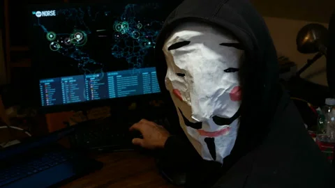 Hacker Hacking Database Computer Hack Screen with Face Mask internet security Stock Footage 145129301