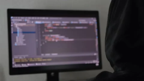 Hacker is hacking a program, an application or data base Stock Footage 154367609
