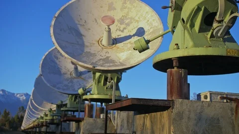Hacker hacks the radio telescope using notebook. Man to program hacking on Stock Footage 98802828