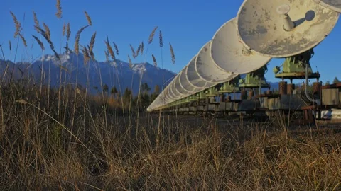 Hacker hacks the radio telescope using notebook. Man to program hacking on Stock Footage 120719210