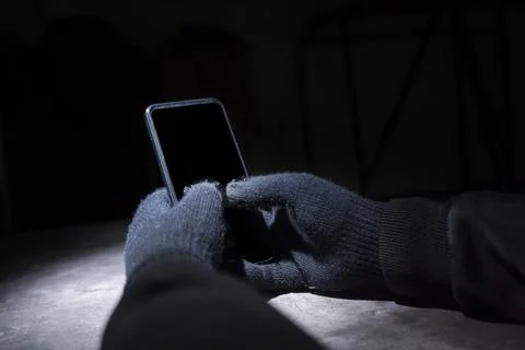 Hacker hand hacking mobile phone security Stock Photos