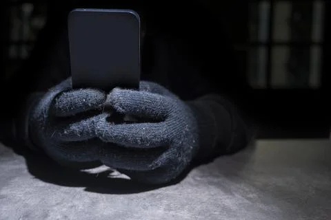 Hacker hand hacking mobile phone security Stock Photos