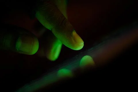 Hacker hand stealing data from laptop , closeup Stock Photos