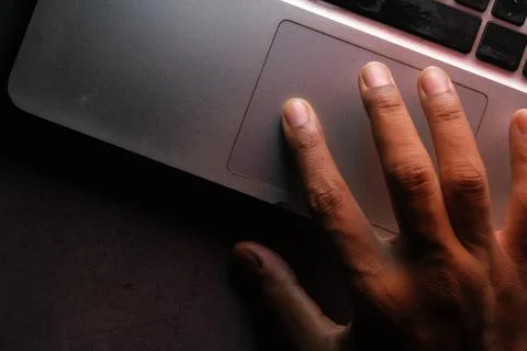 Hacker hand stealing data from laptop top down Foto stock