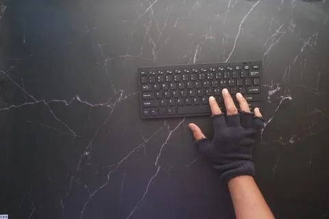 Hacker hand stealing data from laptop top down Stock Photos