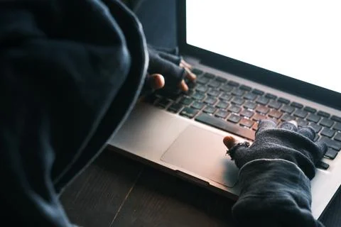 Hacker hand stealing data from laptop top down Stock Photos