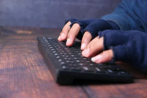 Hacker hand stealing personal data, close up Stock Photos