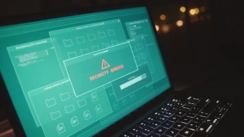 Hacker hands type on laptop keyboard when security breach alert pops on screen Видео 330740205