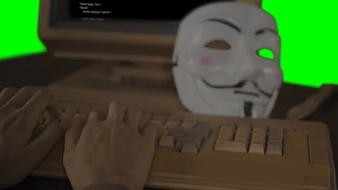 Hacker hands typing code on a computer keyboard Stockbeeldmateriaal 125114885
