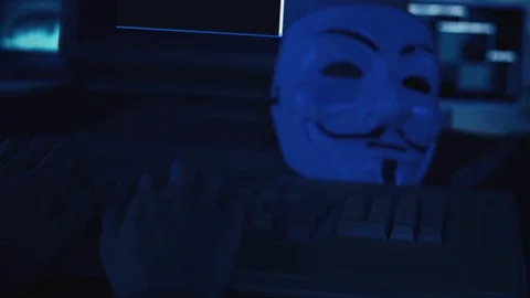 Hacker hands typing code on keyboard during hacks Stockbeeldmateriaal 125115603