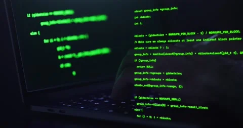 Hacker hands typing on a keyboard, close up view - Man coding using a noteboo Stock Footage 141258665
