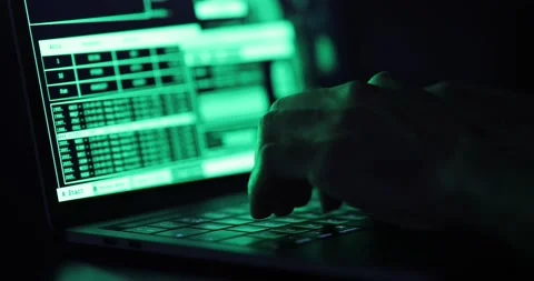 Hacker hands typing on a keyboard, close up view - Man coding using a noteboo Stock Footage 141925428