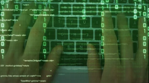 Hacker hands typing on laptop keyboard Stock Footage 129893542