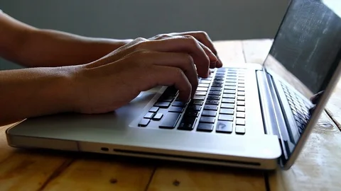Hacker hands typing on laptop keypad dark tone video. Stock Footage 96326375
