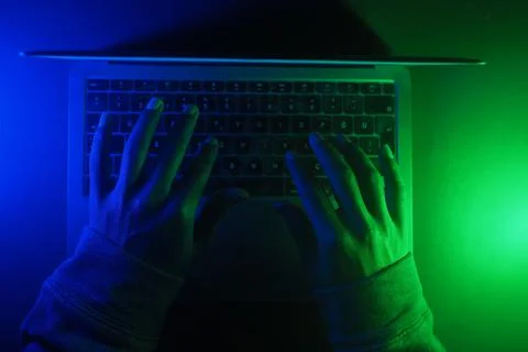Hacker Hands working on a laptop, cyber crime concept 스톡 사진