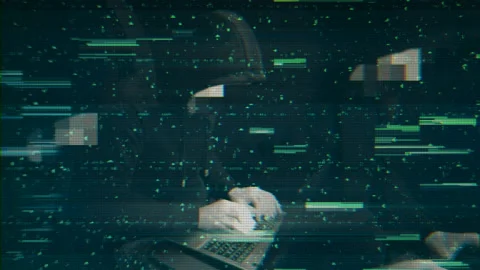 Hacker hided face is working at the comp... | Stock Video | Pond5