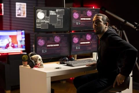 Hacker in hideout preparing to escape before getting caught by police Stock Photos