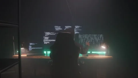 Hacker Hiding in a Dark Room | Stock Video | Pond5