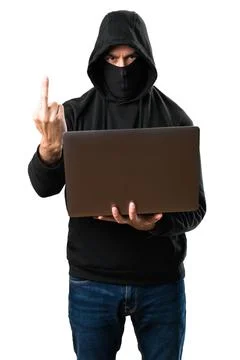 Hacker with his computer making horn gesture on isolated white background 스톡 사진