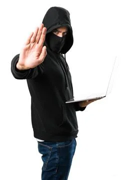 Hacker with his computer making stop sign on isolated white background Foto stock